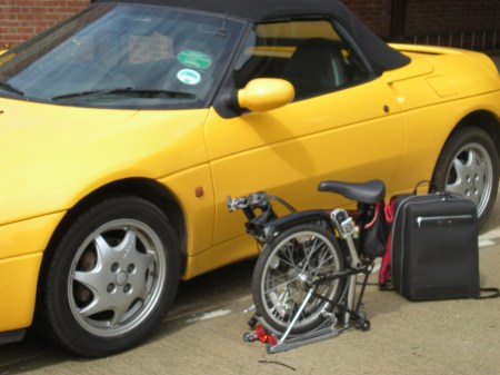 Lotus Elan, Brompton Bicycle and a Paul Smith Case